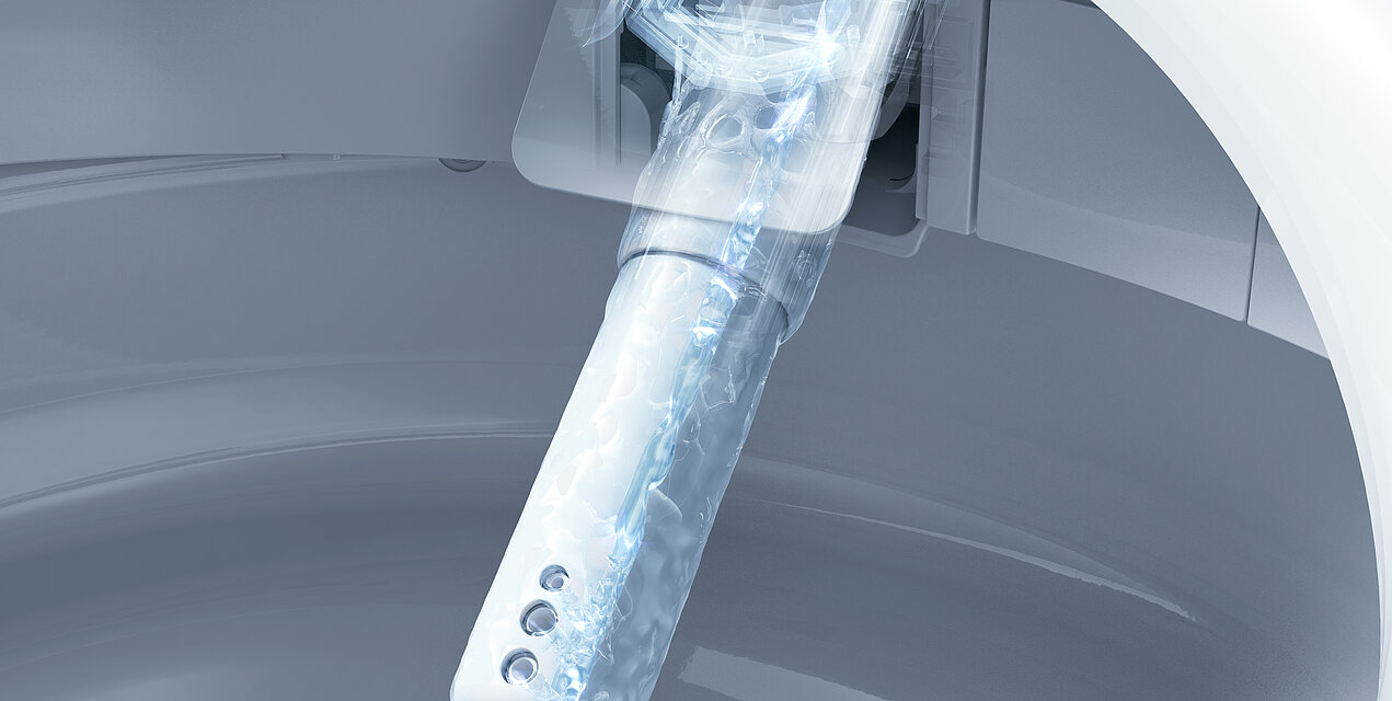 wand jet WASHLET Une buse se trouve à l'intérieur d'une céramique. La buse est représentée en transparence, de sorte que l'on peut voir l'eau qui s'écoule à l'intérieur.